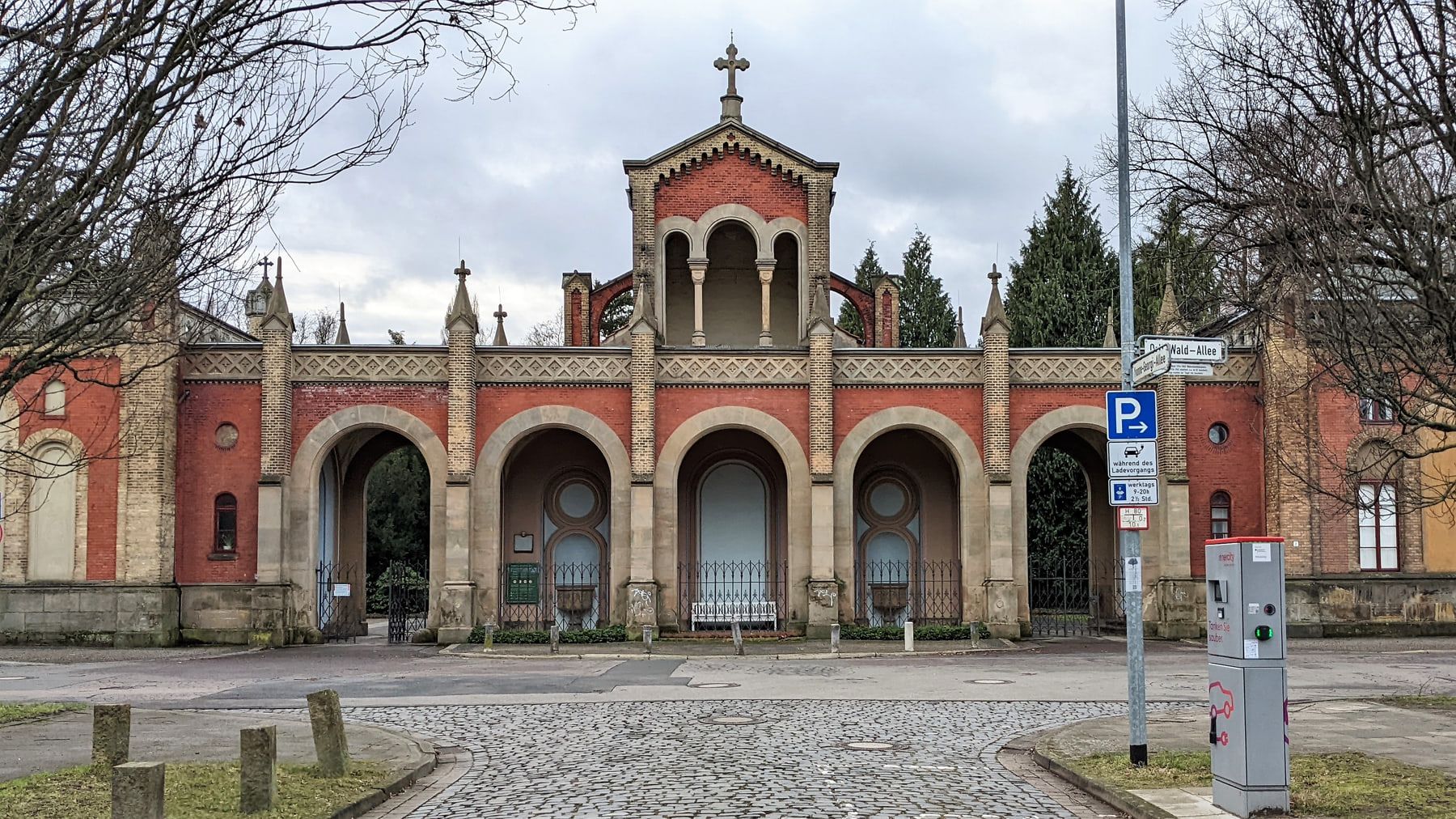 Front view of the historic red-brick gateway with arcades and a bell turret at Engesohde City Cemetery