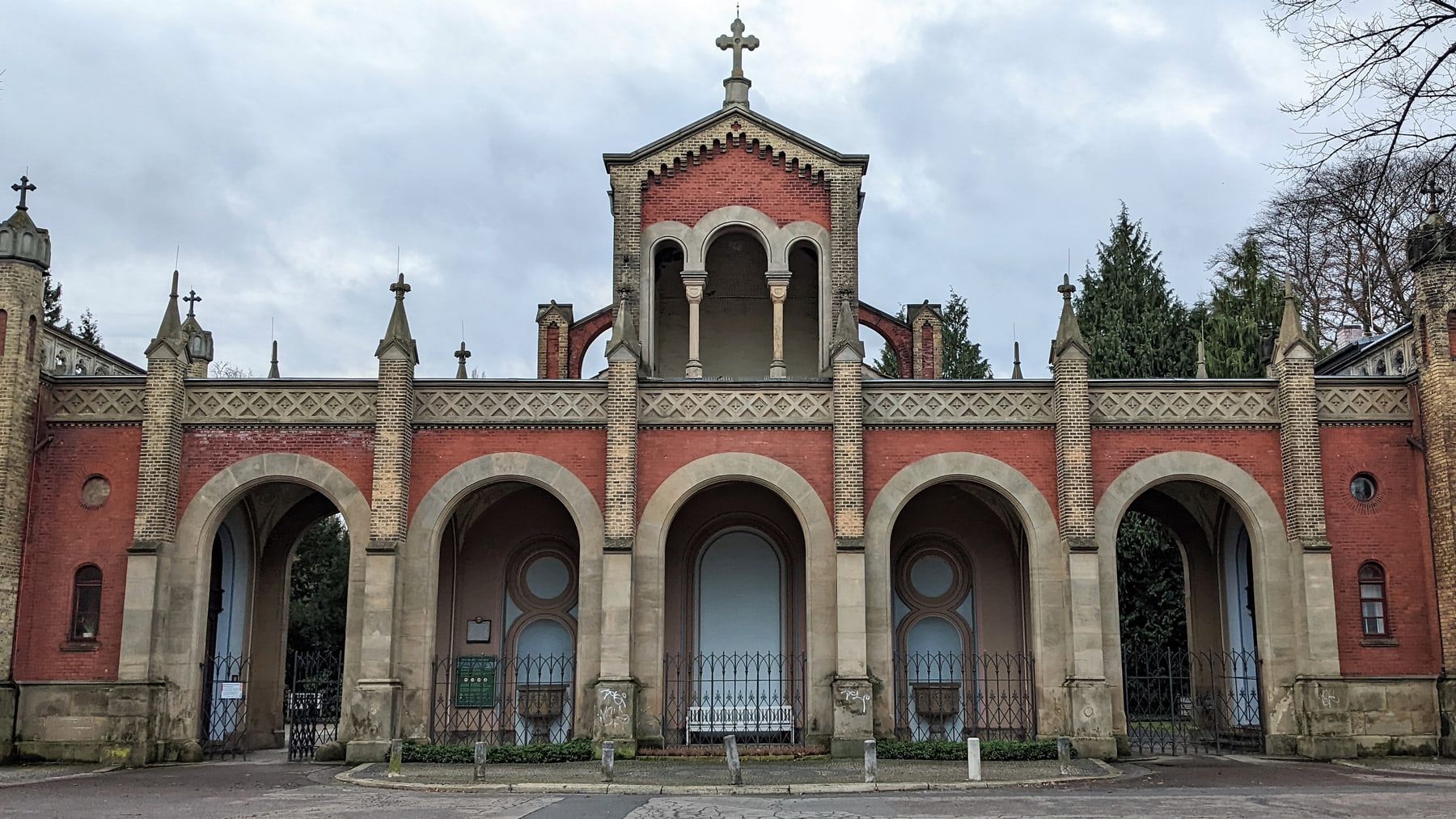 Close view of the five-arched red-brick entrance facade at Engesohde City Cemetery